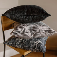 three pillows stacked on top of each other