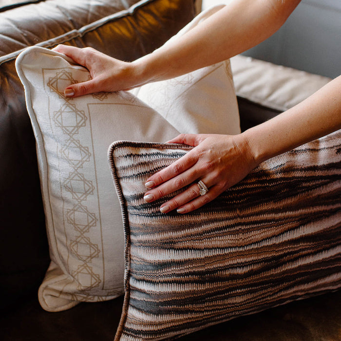 two pillows aligned on a couch