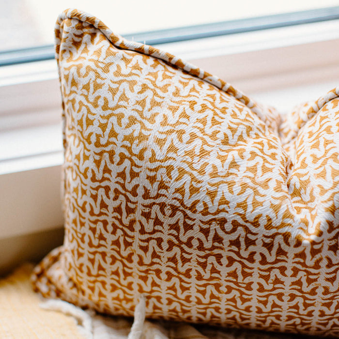 pillow sitting on window sill